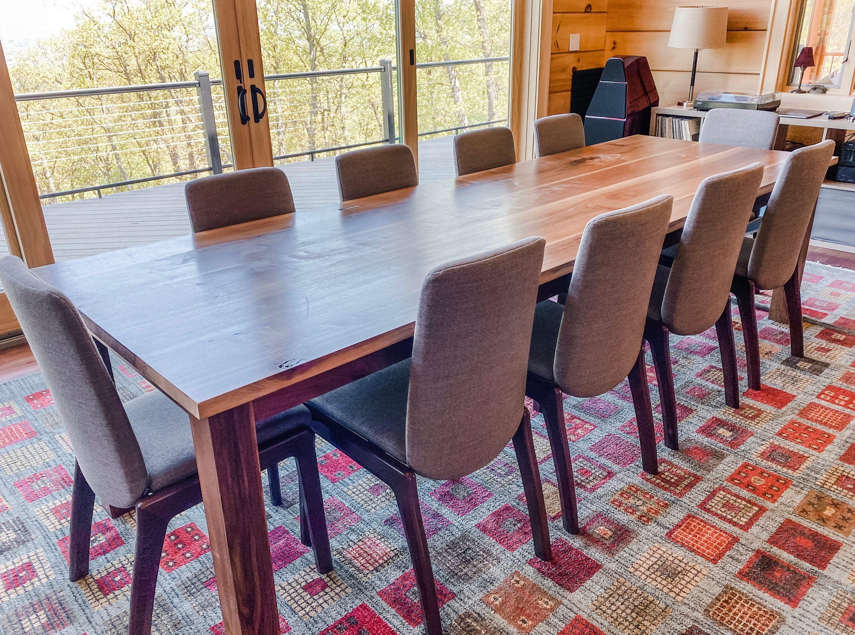 Walnut table with black chairs hot sale